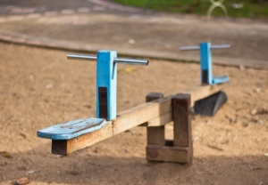 15758505 - old wooden see saw at the playground